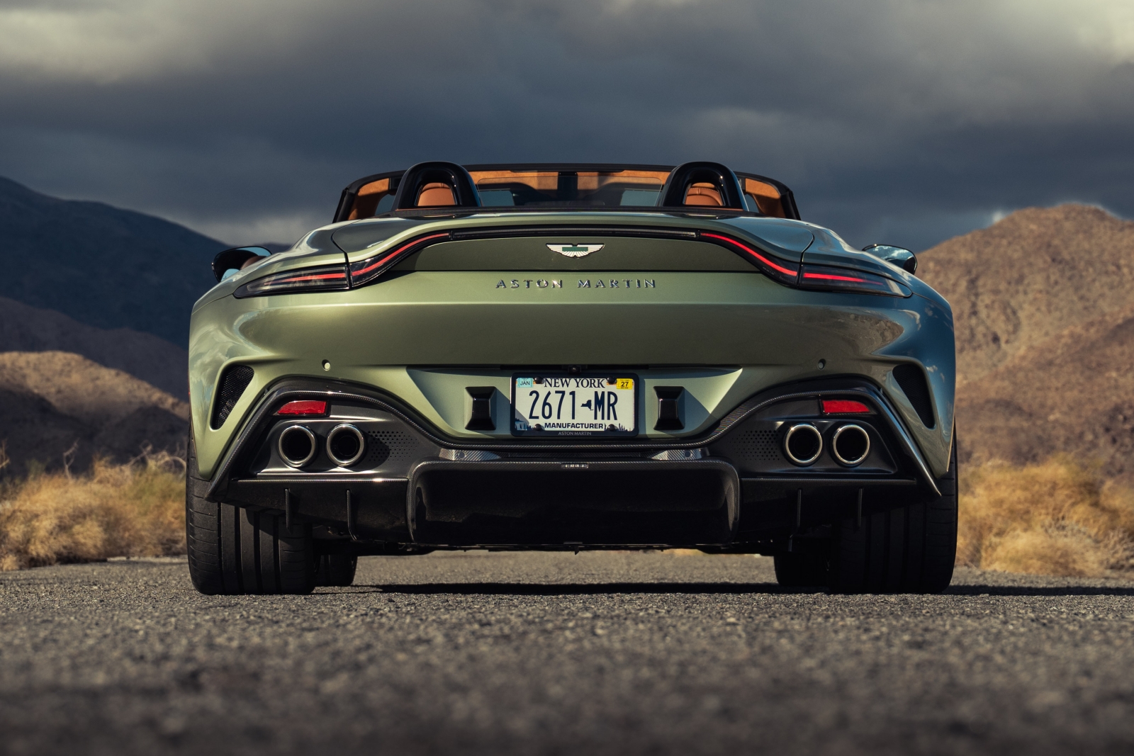 2026 Aston Martin Vantage Roadster exterior view of the rear, with light green metallic paint