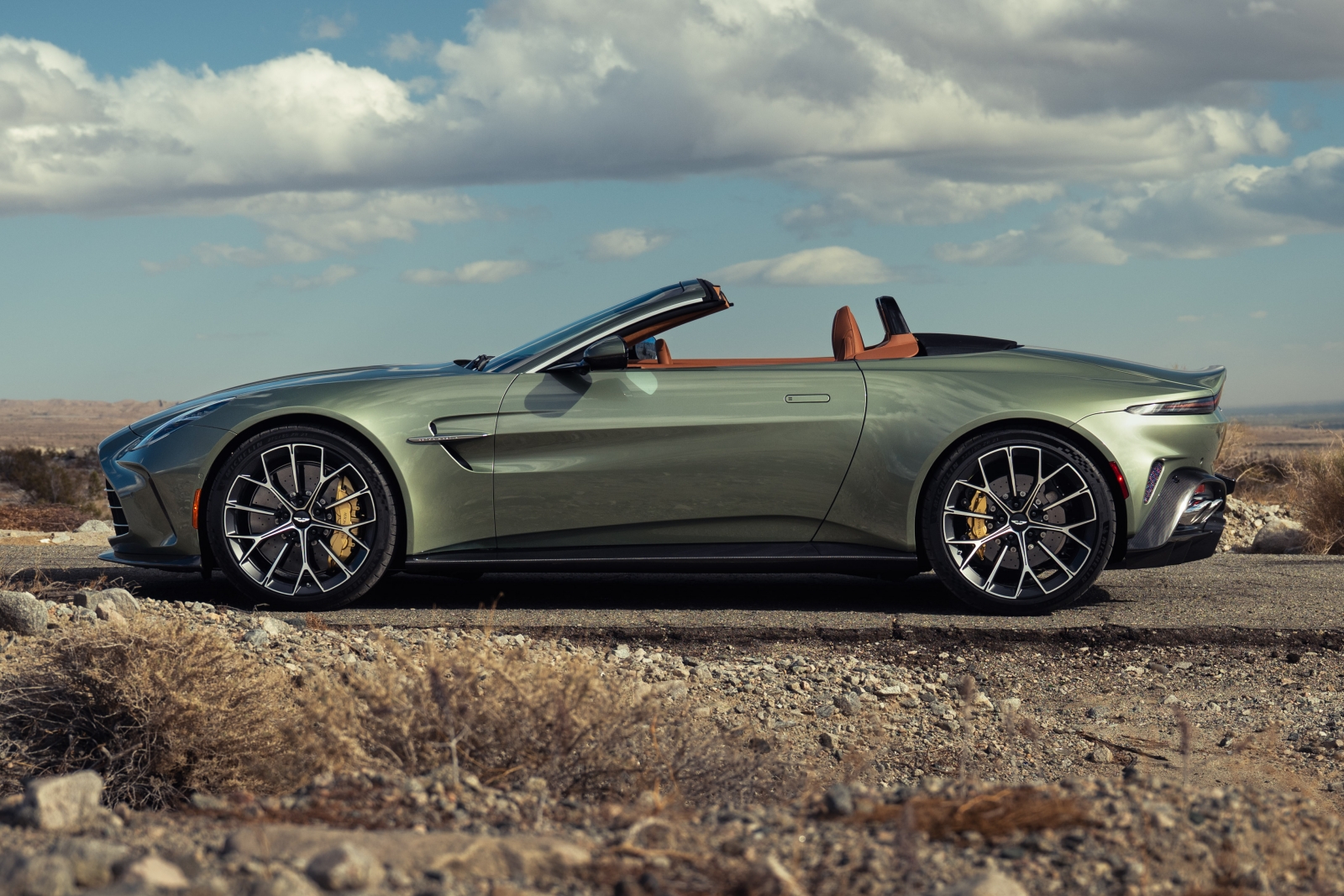 2026 Aston Martin Vantage Roadster exterior view of the side, with light green metallic paint